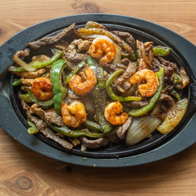 Texas Fajitas Steak, Chicken, & Shrimp.